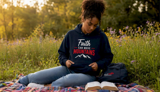 Young woman wearing Armor of God hoodie at home