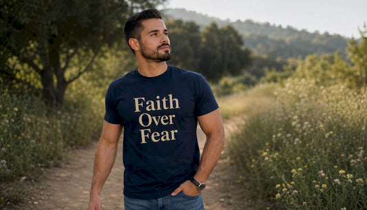 Man wearing navy Christian T-shirt reading Faith Over Fear