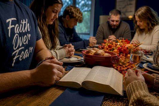 Family reading Bible at Thanksgiving table